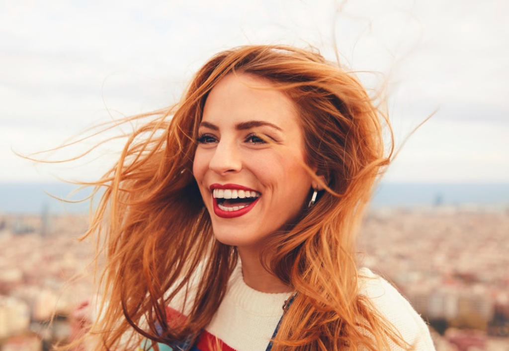 smiling girl with red painted lips